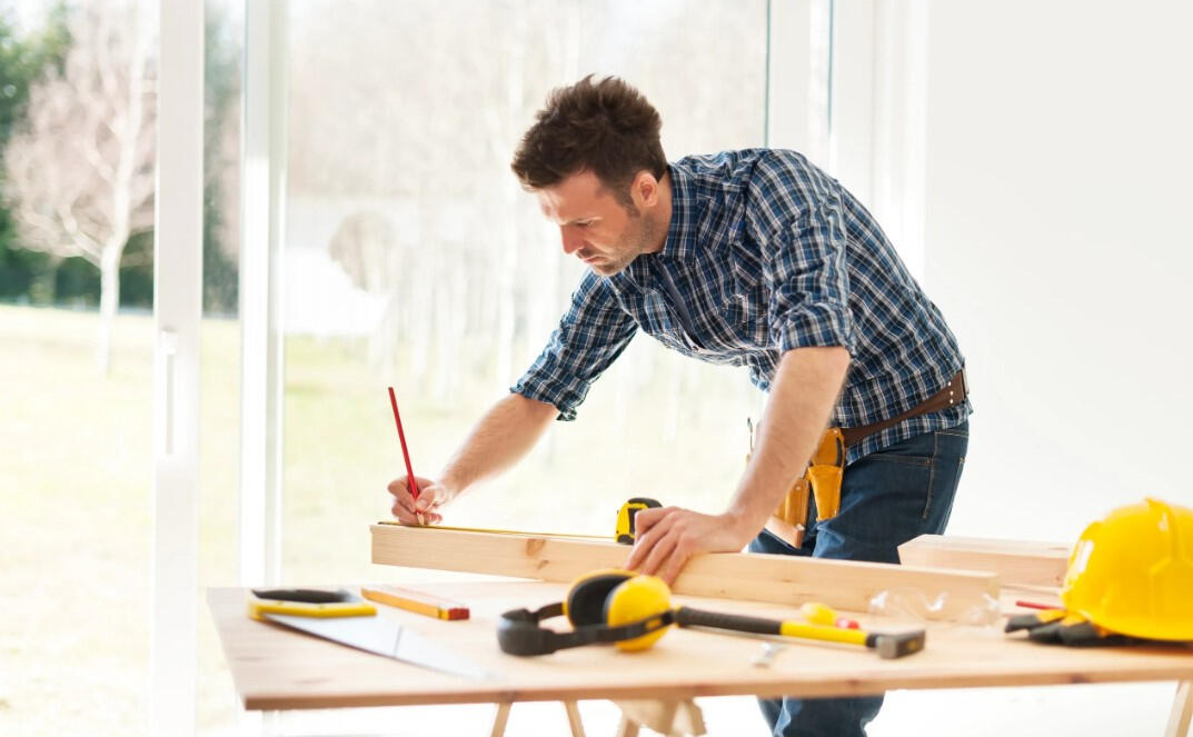 Local Handyman Providing Home Repairs A skilled handyman from ValuePro Home Services performing residential home maintenance work in the Merrimack Valley area